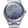 Orient RA-AC0M10L30B Bambino Version 7 watch featuring 38mm case, blue sunburst dial, date window at 3 o'clock, and polished steel bracelet